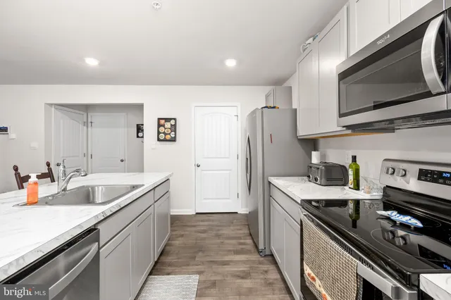 a bathroom with a sink a mirror and a toilet