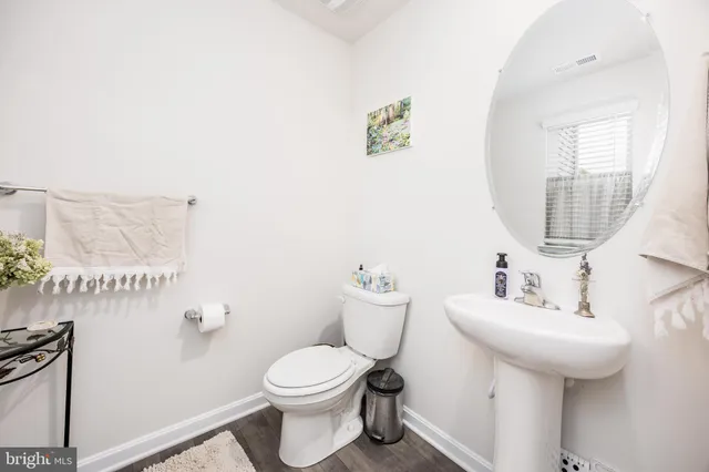 a bedroom with furniture and a chandelier fan
