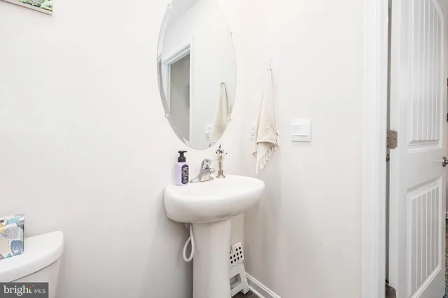 a bedroom with furniture and a wooden floor