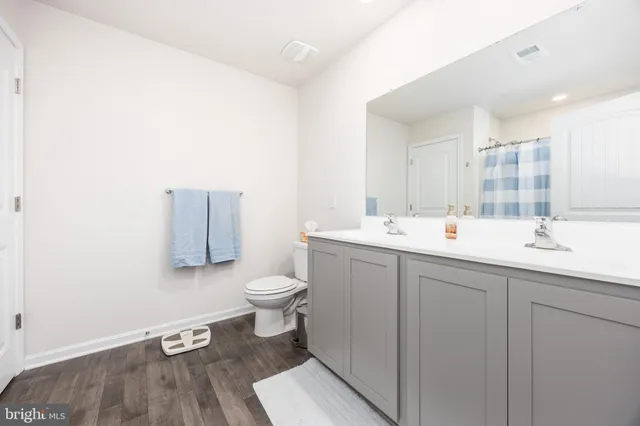 a room with lots of books and a view of bedroom