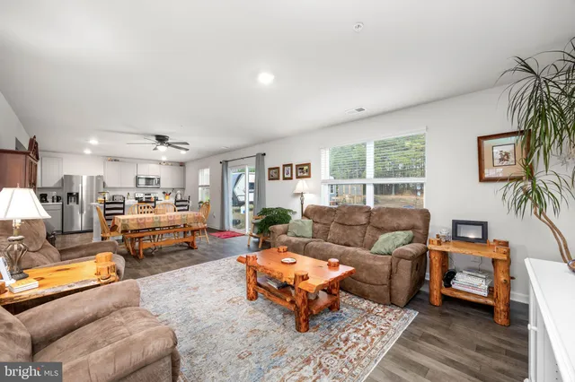 a living room with furniture and a table