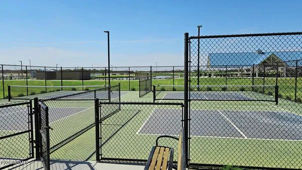 a view of a deck with a floor to ceiling window