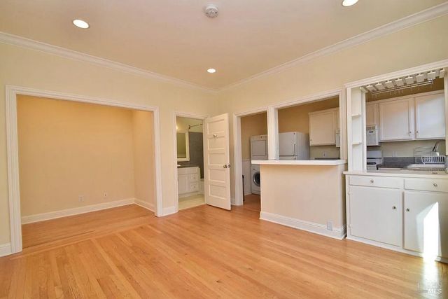 a kitchen with a refrigerator and window