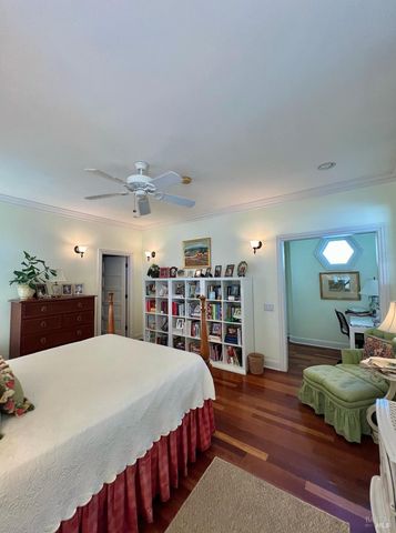 a spacious bedroom with a bed and a couch