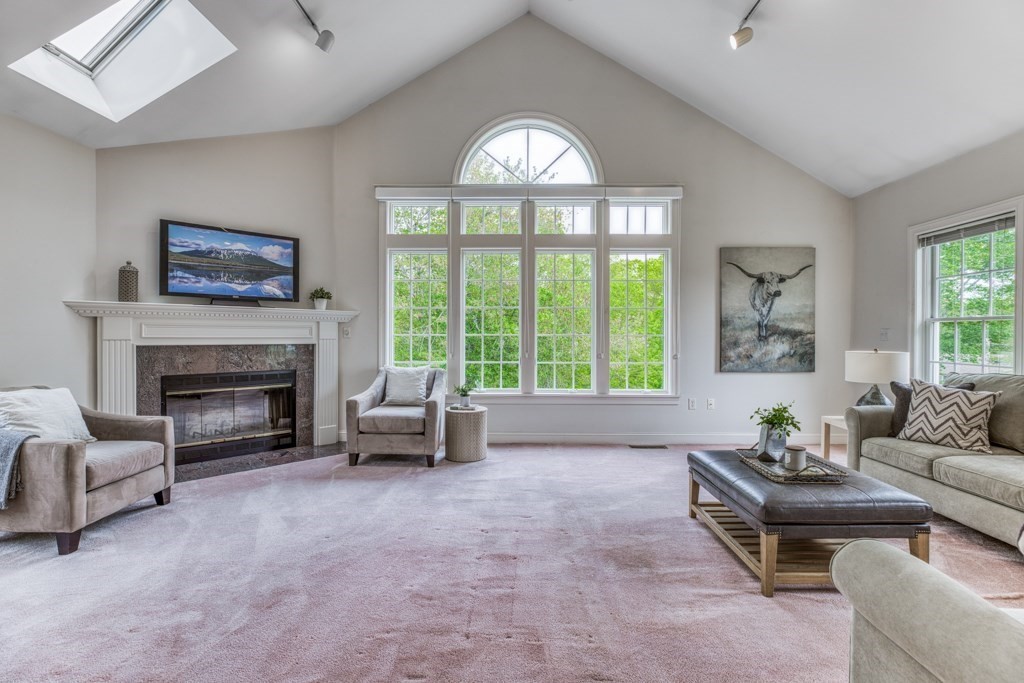 51 Glendale Road Boxford, MA 01921 - Photo 13 of 37 a living room with furniture a large window and a fireplace