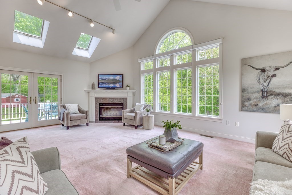 51 Glendale Road Boxford, MA 01921 - Photo 14 of 37 a living room with furniture a fireplace and a large window