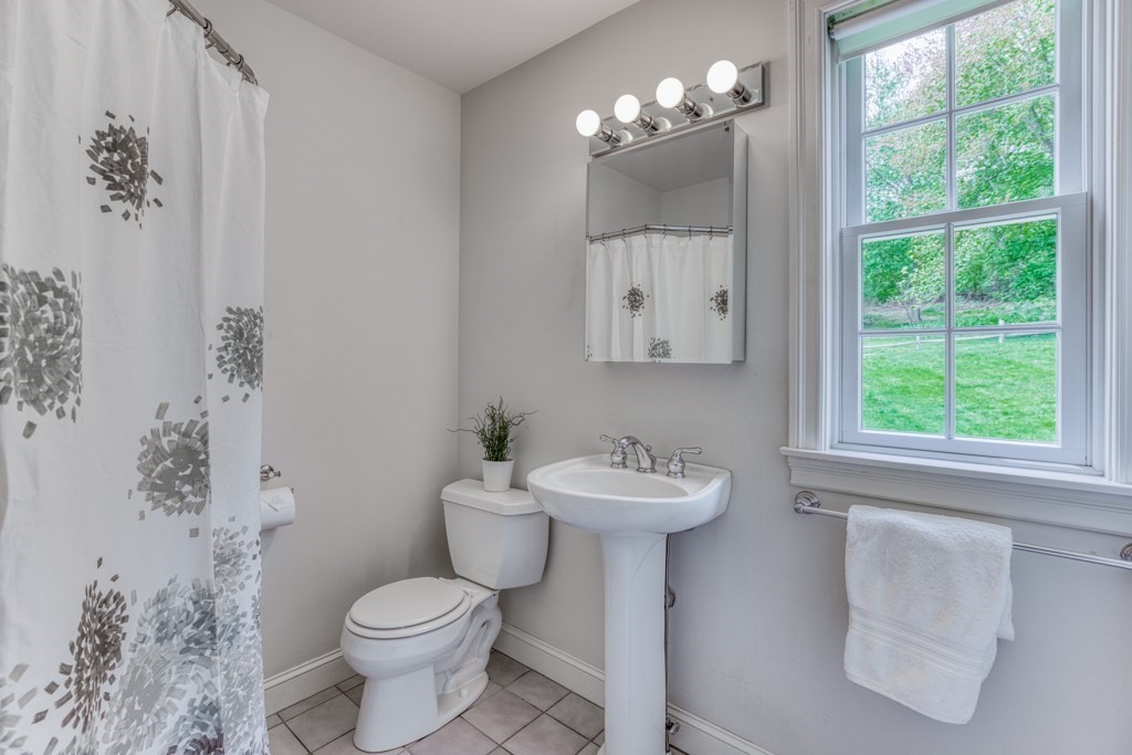 51 Glendale Road Boxford, MA 01921 - Photo 17 of 37 a bathroom with a toilet sink and mirror