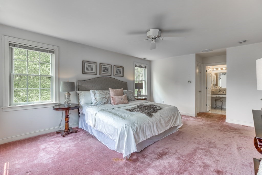 51 Glendale Road Boxford, MA 01921 - Photo 19 of 37 a spacious bedroom with a bed and a window