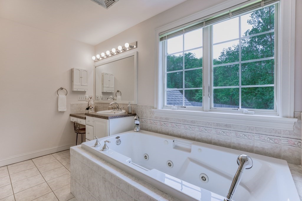 51 Glendale Road Boxford, MA 01921 - Photo 22 of 37 a bathroom with a tub a sink and a window