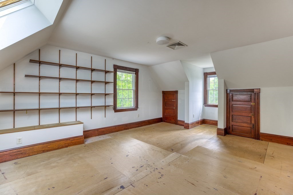 51 Glendale Road Boxford, MA 01921 - Photo 31 of 37 an empty room with windows and cabinet