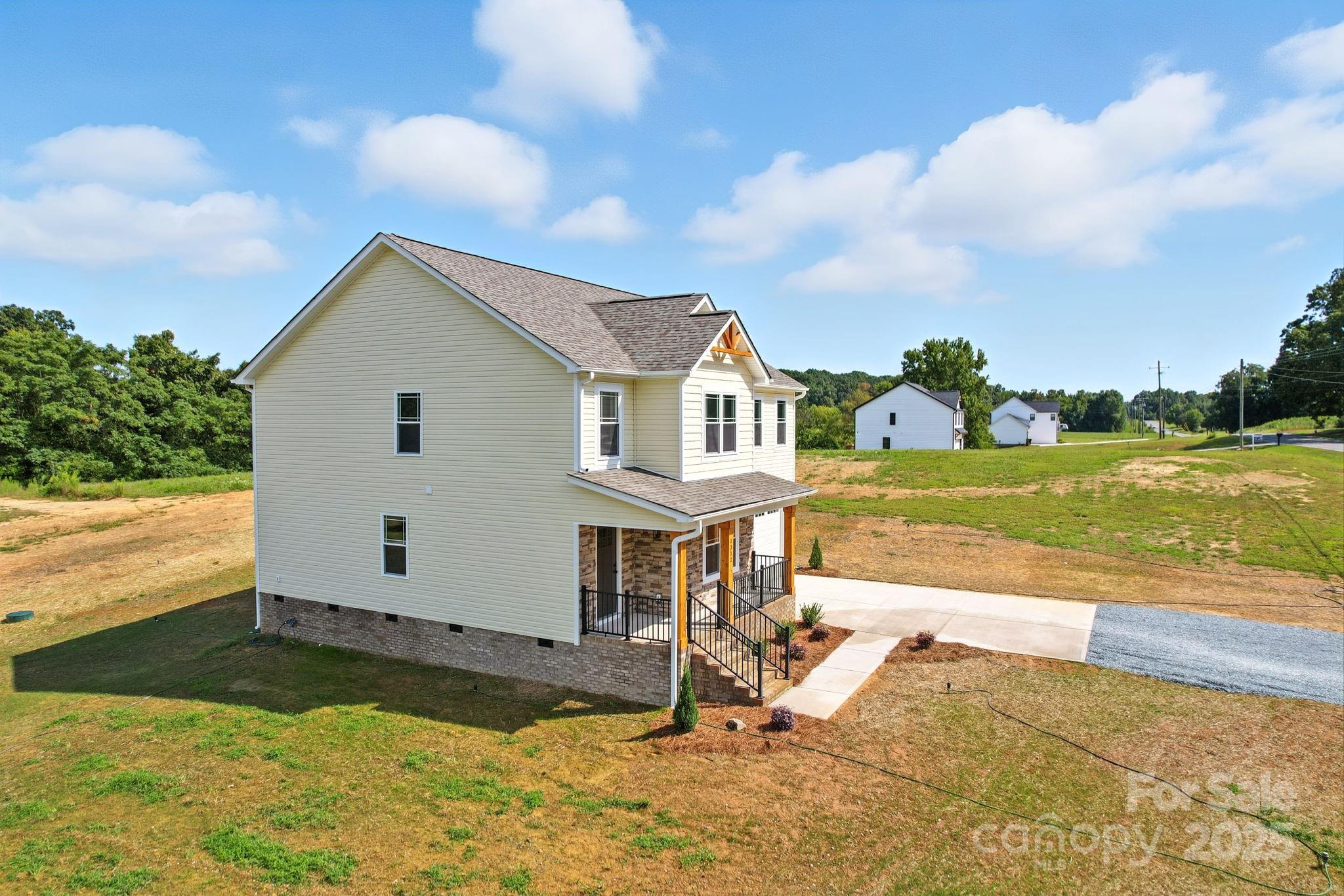 1312 Austin Chaney Road Wingate, NC 28174 - Photo 2 of 47 a view of a house with yard and sitting area