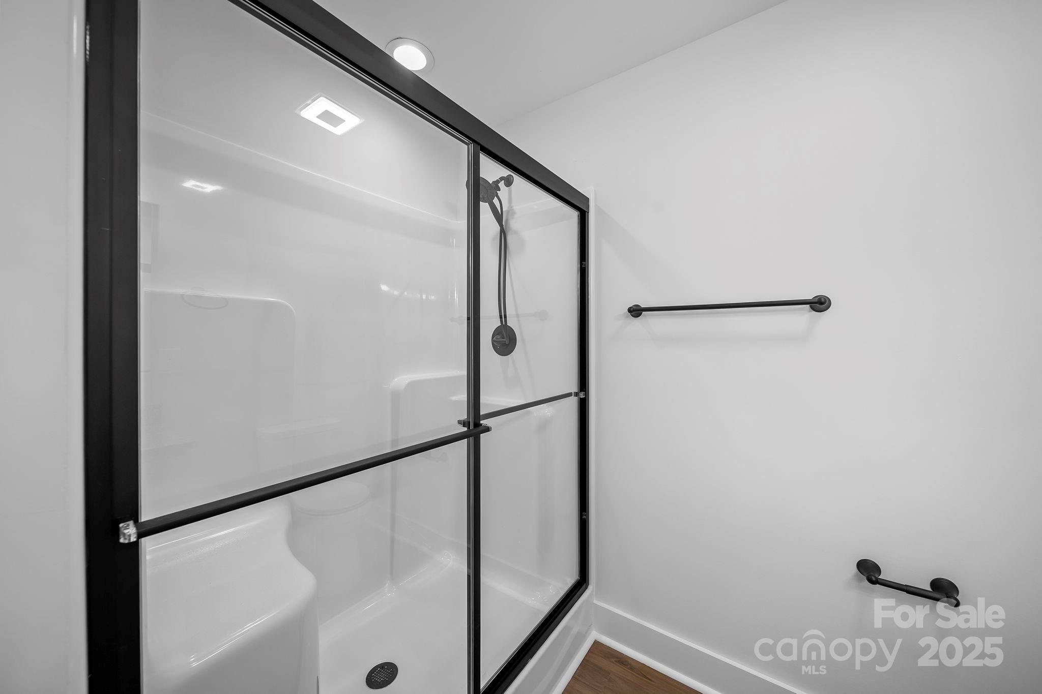 1312 Austin Chaney Road Wingate, NC 28174 - Photo 22 of 47 a bathroom with a shower and a glass door