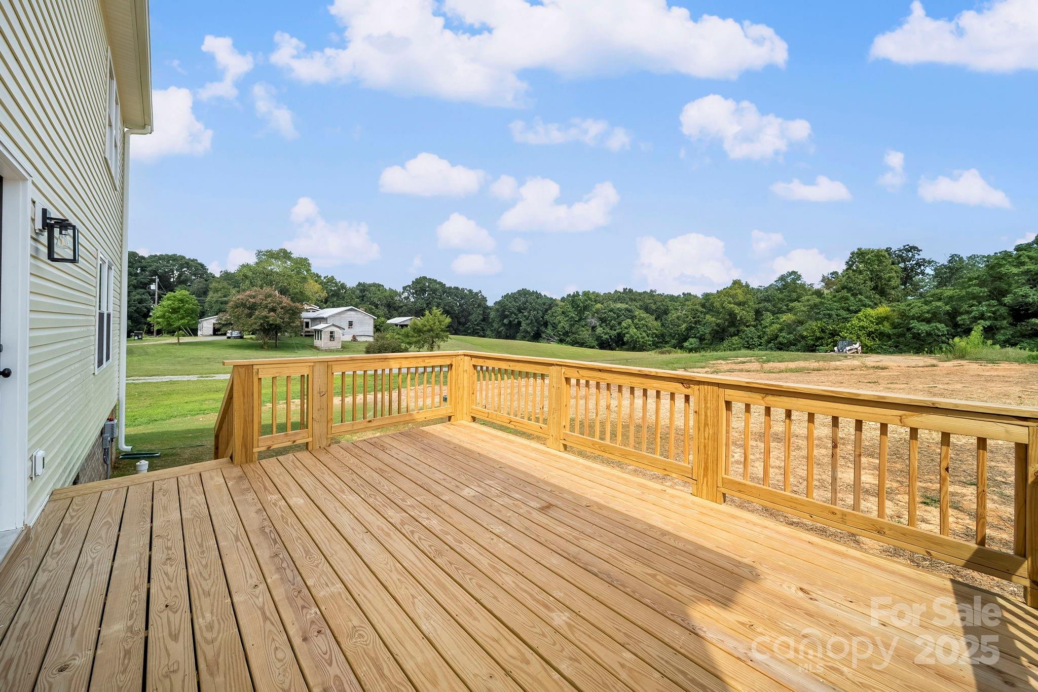 1312 Austin Chaney Road Wingate, NC 28174 - Photo 42 of 47 a view of balcony with wooden floor and fence