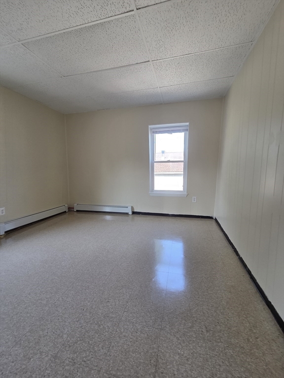 2038-2046 Main Street, Unit 2 Three Rivers, MA 01080 - Photo 14 of 18 an empty room with wooden floor and windows