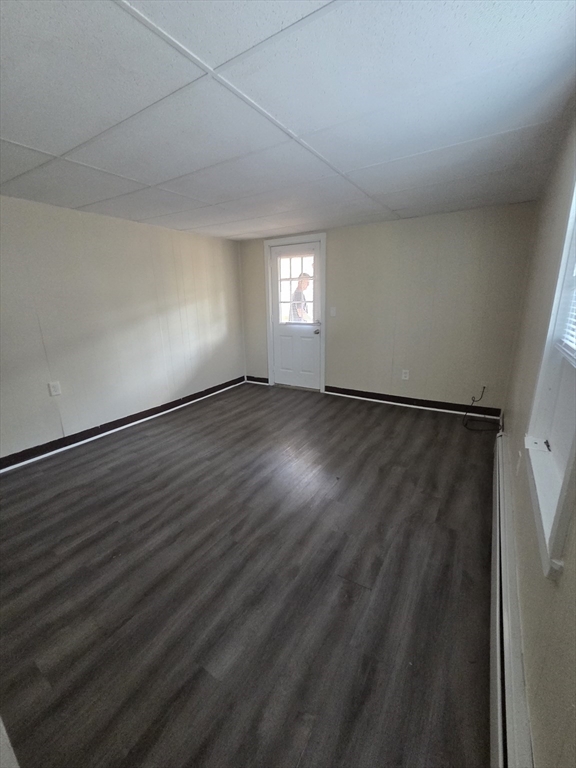 2038-2046 Main Street, Unit 2 Three Rivers, MA 01080 - Photo 16 of 18 a view of an empty room with wooden floor and a window