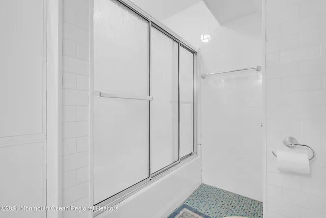 a bathroom with a shower and a toilet