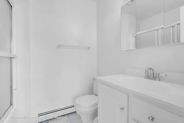 a bathroom with a sink toilet and vanity