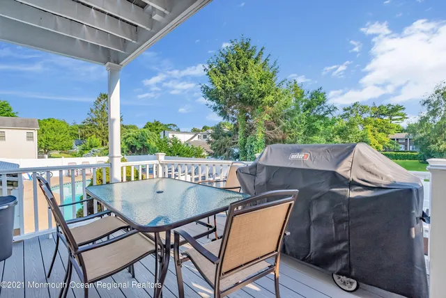 a view of a balcony with furniture