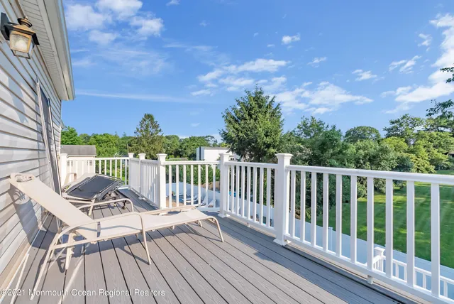 a view of a two chairs on the roof deck