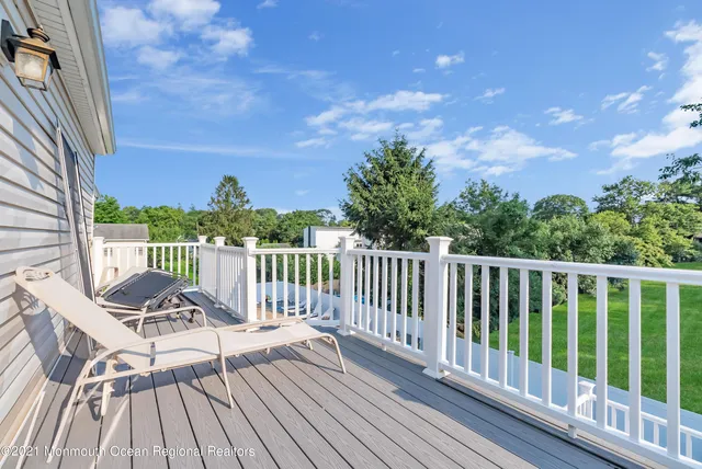 a view of a two chairs on the roof deck