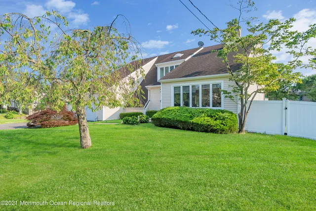 a house with a tree in the background