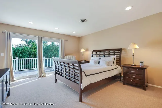 a bedroom with a bed and a lamp with window