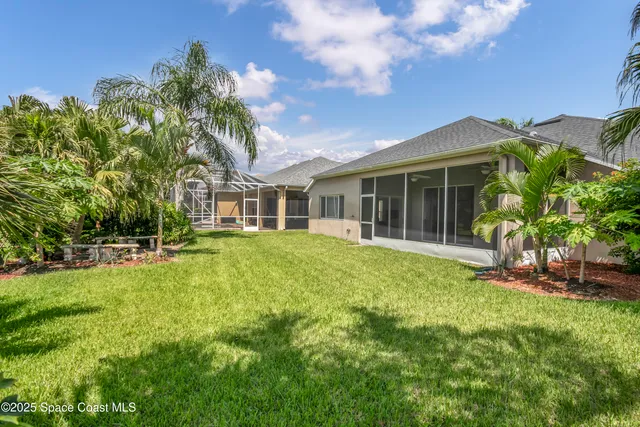 a view of a lake with houses in the background