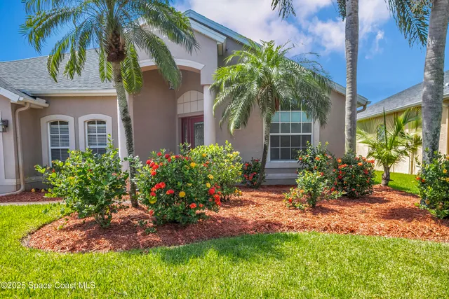 a living room with furniture a window and wooden floor