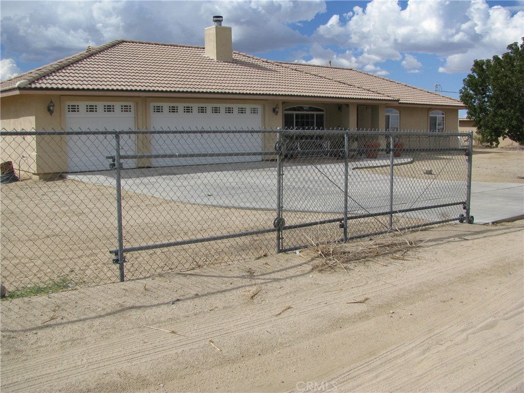12834 Paramount Road Phelan, CA 92371 - Photo 1 of 1 a view of a house with a garage