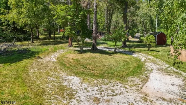 a view of a yard with swimming pool