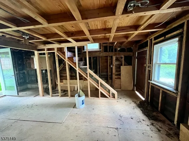a view of a room with wooden walls