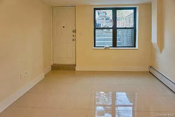 a view of a room that has a window in it