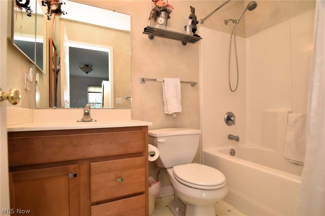 23825 Rockside Road Bedford, OH 44146 - Photo 14 of 22 Full bathroom with shower combination, tile floors, toilet, and large vanity