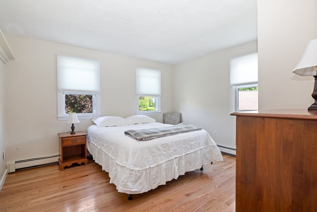 6 Wight Farm Road Natick, MA 01760 - Photo 16 of 37 a bedroom with a bed and wooden floor
