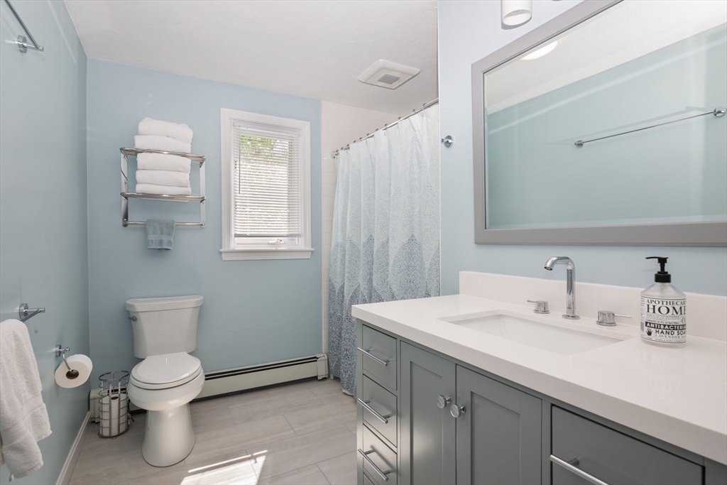 6 Wight Farm Road Natick, MA 01760 - Photo 17 of 37 a bathroom with a toilet sink and mirror