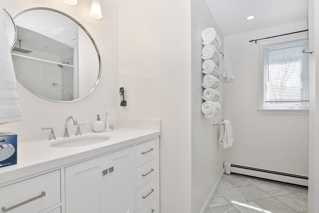 6 Wight Farm Road Natick, MA 01760 - Photo 24 of 37 a bathroom with a sink vanity and a mirror