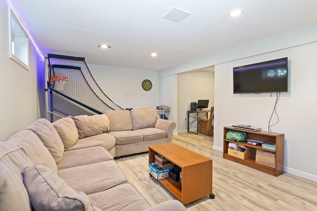 6 Wight Farm Road Natick, MA 01760 - Photo 25 of 37 a living room with furniture and a flat screen tv
