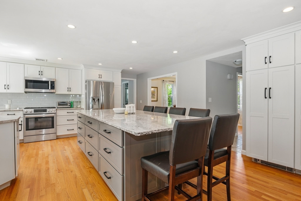 6 Wight Farm Road Natick, MA 01760 - Photo 3 of 37 a large kitchen with granite countertop lots of counter space and stainless steel appliances