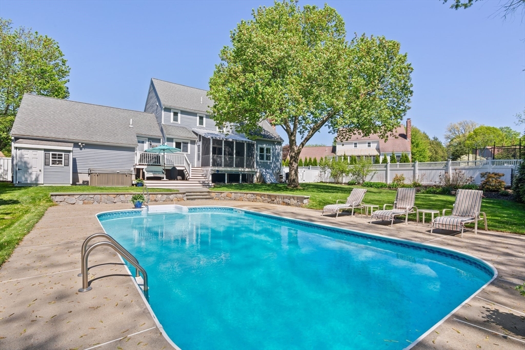 6 Wight Farm Road Natick, MA 01760 - Photo 31 of 37 a view of a swimming pool with a lounge chairs