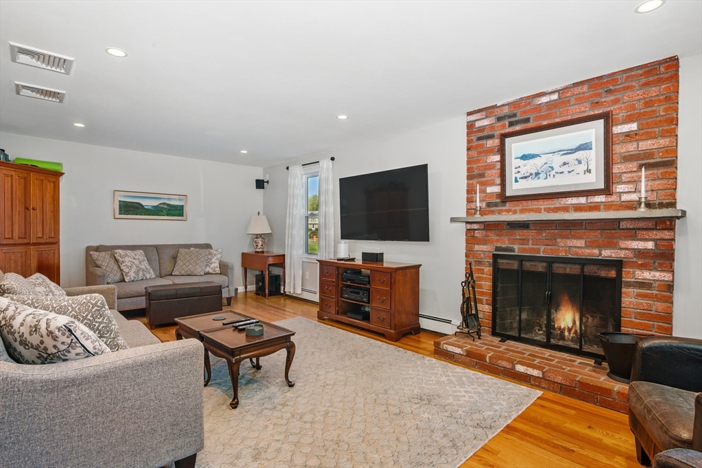 6 Wight Farm Road Natick, MA 01760 - Photo 7 of 37 a living room with furniture and a fireplace