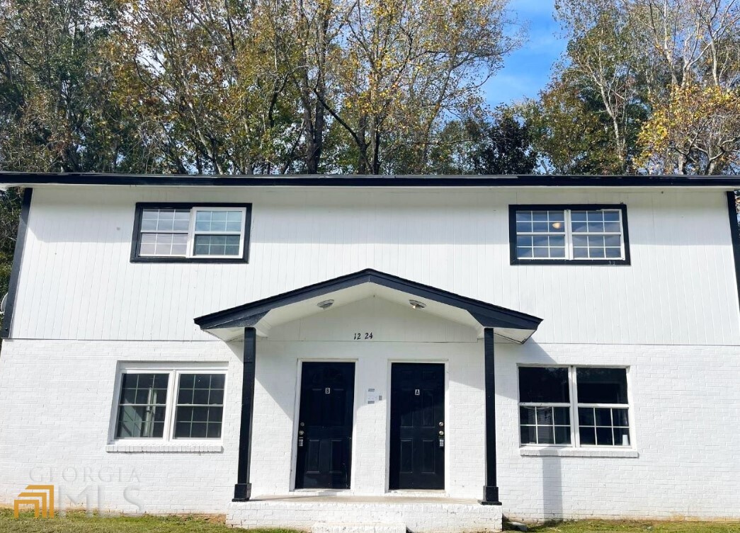 1224 Appling Court Macon, GA 31217 - Photo 1 of 1 a front view of a house with a yard
