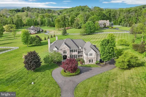 a aerial view of a house with a big yard