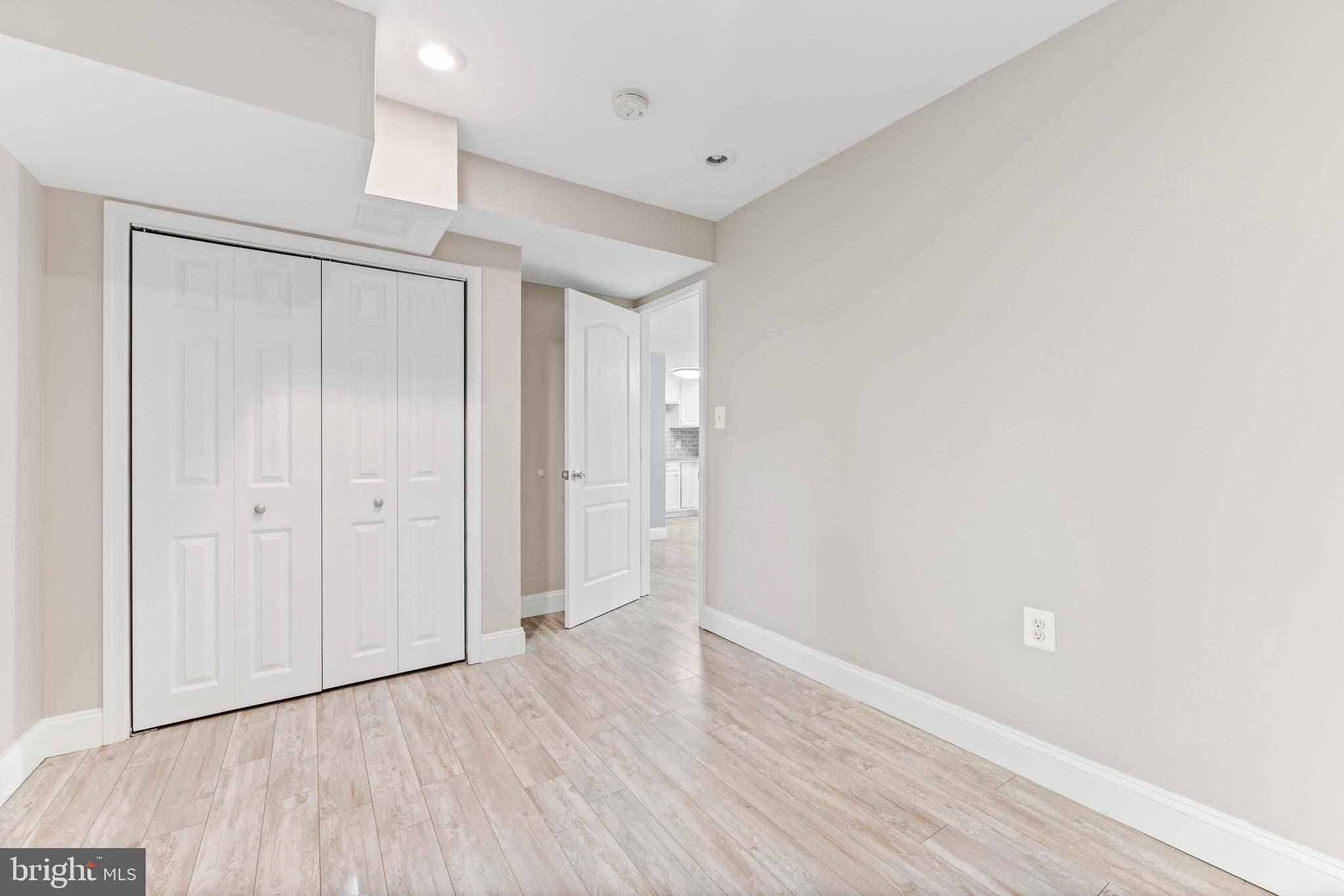 7140 Stone Throw Way Elkridge, MD 21075 - Photo 7 of 9 a view of an empty room with wooden floor