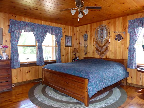2039 B White Pond Road Athol, MA 01331 - Photo 8 of 28 a bed sitting in a bedroom next to a window