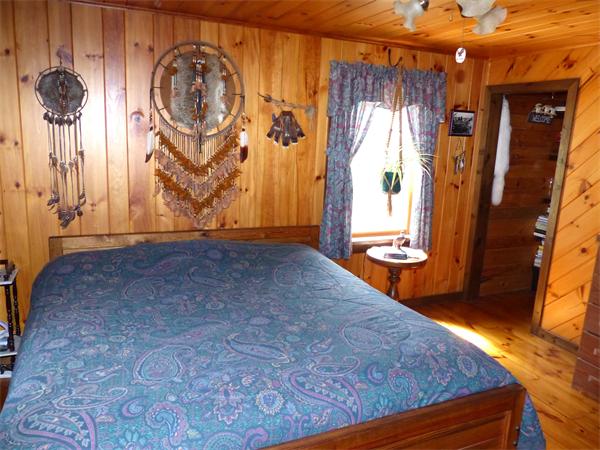 2039 B White Pond Road Athol, MA 01331 - Photo 9 of 28 an empty room with a door and a chandelier