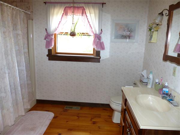 2039 B White Pond Road Athol, MA 01331 - Photo 10 of 28 a bathroom with a sink a vanity and a mirror