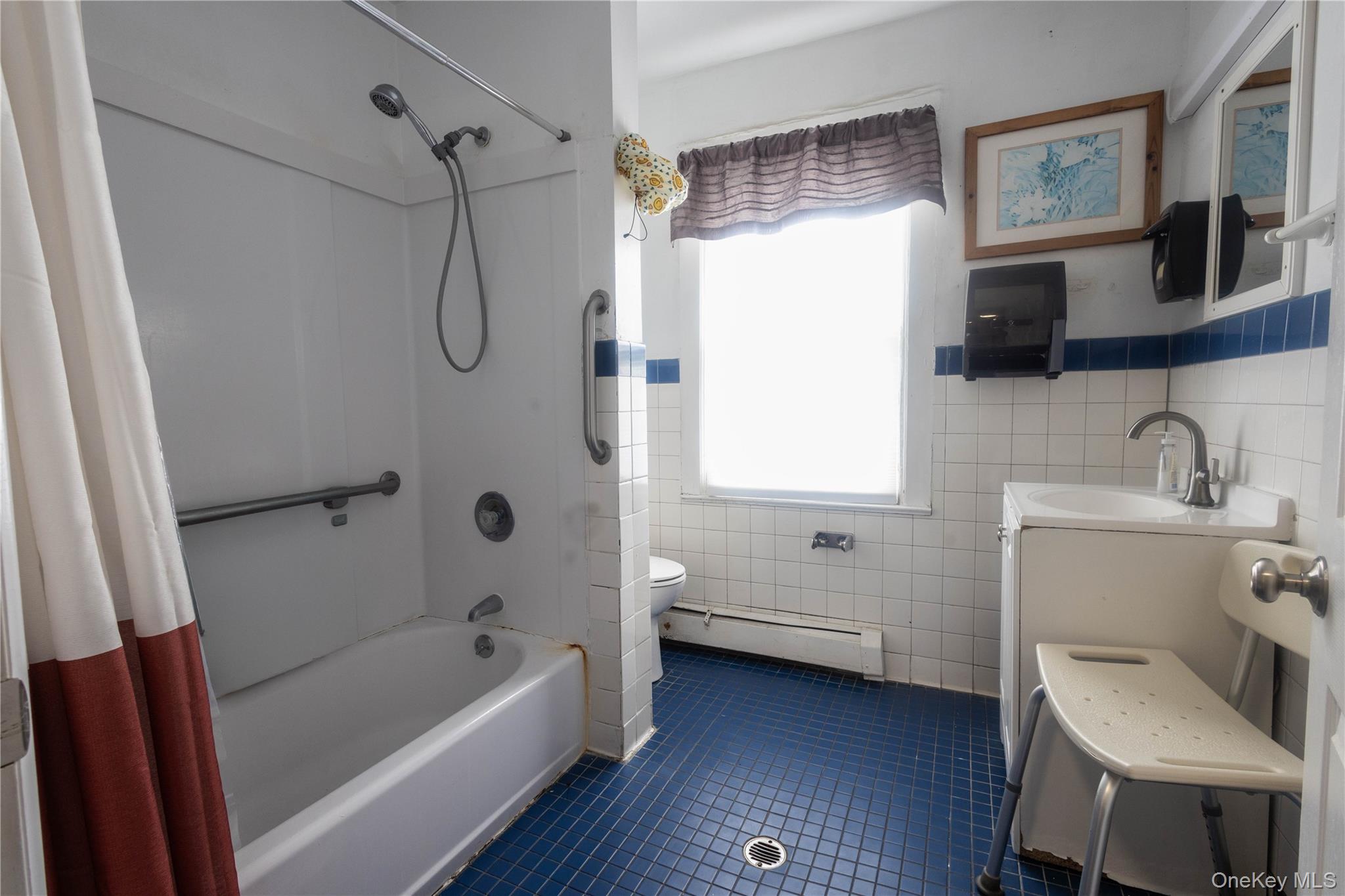 2 Old Cedar Swamp Road Jericho, NY 11753 - Photo 22 of 30 a bathroom with a sink a toilet and shower