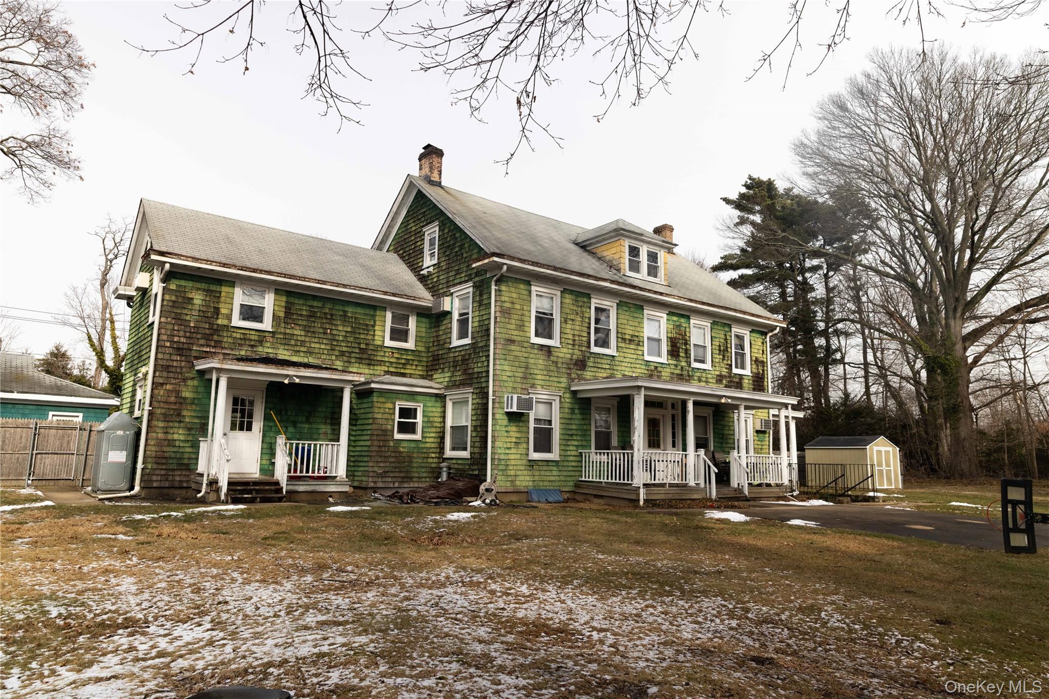 2 Old Cedar Swamp Road Jericho, NY 11753 - Photo 28 of 30 a front view of a house with a yard
