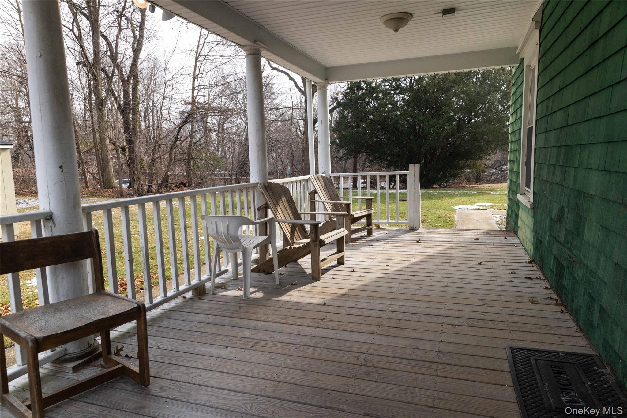 2 Old Cedar Swamp Road Jericho, NY 11753 - Photo 30 of 30 a view of balcony with wooden floor and outdoor seating