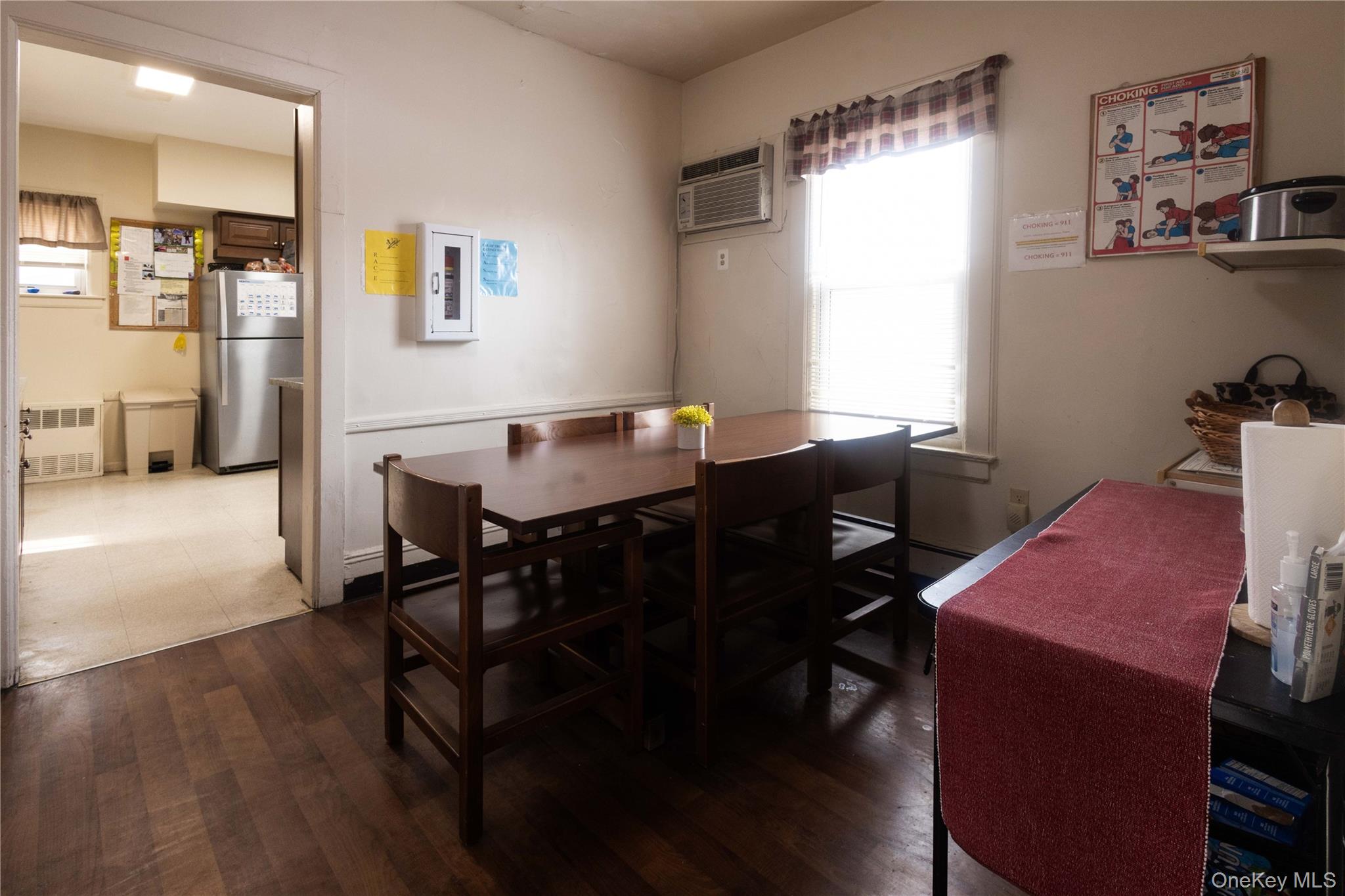 2 Old Cedar Swamp Road Jericho, NY 11753 - Photo 8 of 30 a view of a dining room with furniture and wooden floor